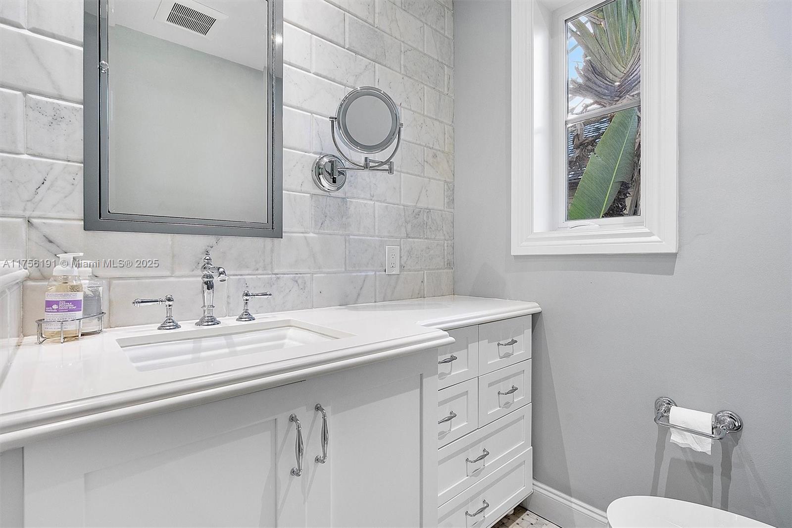 524 Hardee Road Coral Gables, FL 33146 - Photo 32 of 48 a bathroom with a granite countertop sink a toilet and a mirror