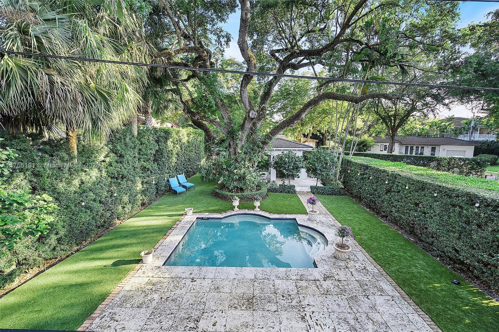 524 Hardee Road Coral Gables, FL 33146 - Photo 44 of 48 a view of a swimming pool with a patio