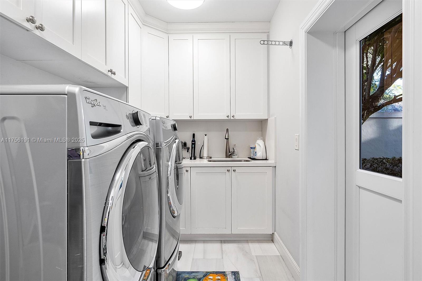 524 Hardee Road Coral Gables, FL 33146 - Photo 45 of 48 a utility room with wooden floor washer and dryer