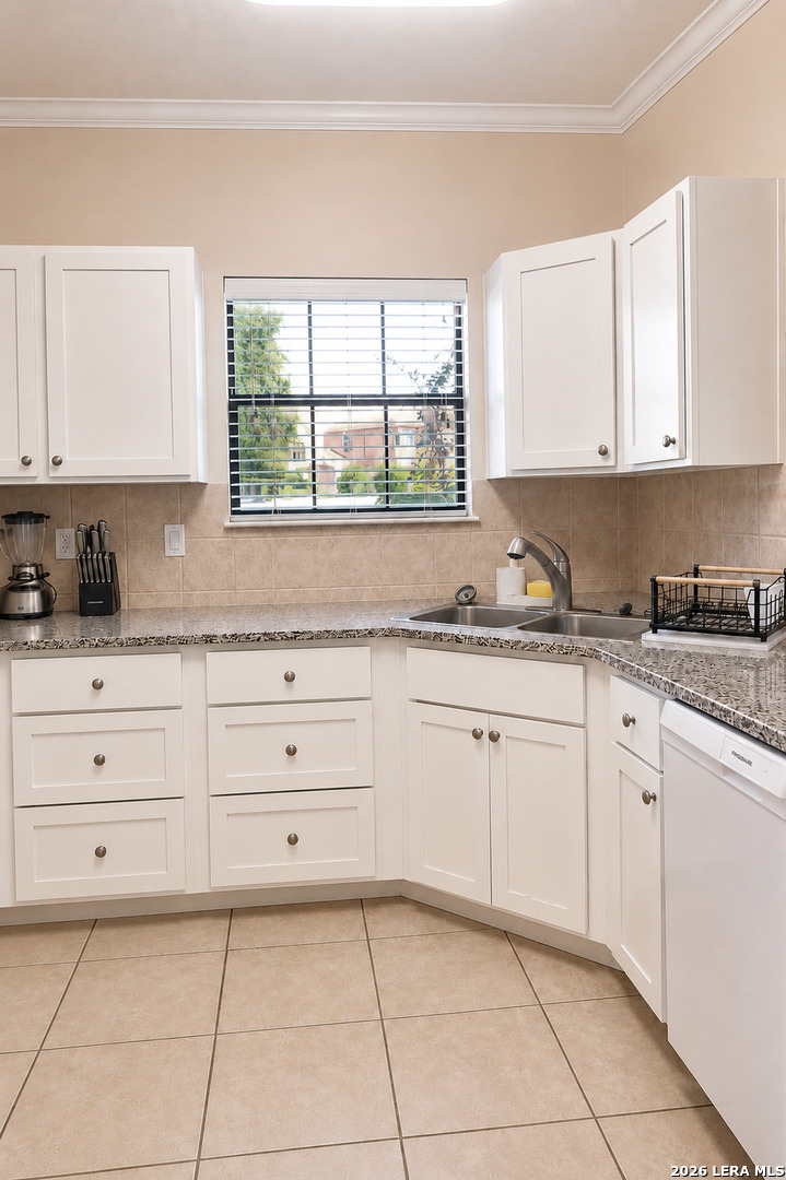 6160 Eckhert Road, Unit 804 San Antonio, TX 78240 - Photo 11 of 38 a kitchen with cabinets appliances a sink and a window
