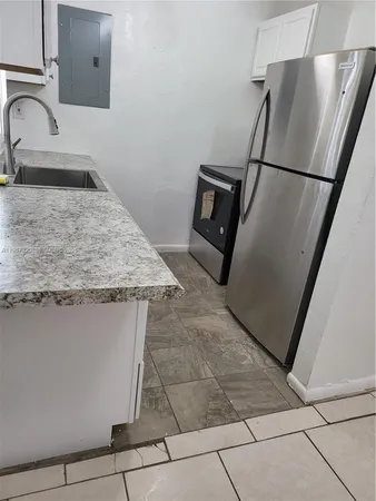 a bathroom with a sink a mirror and vanity