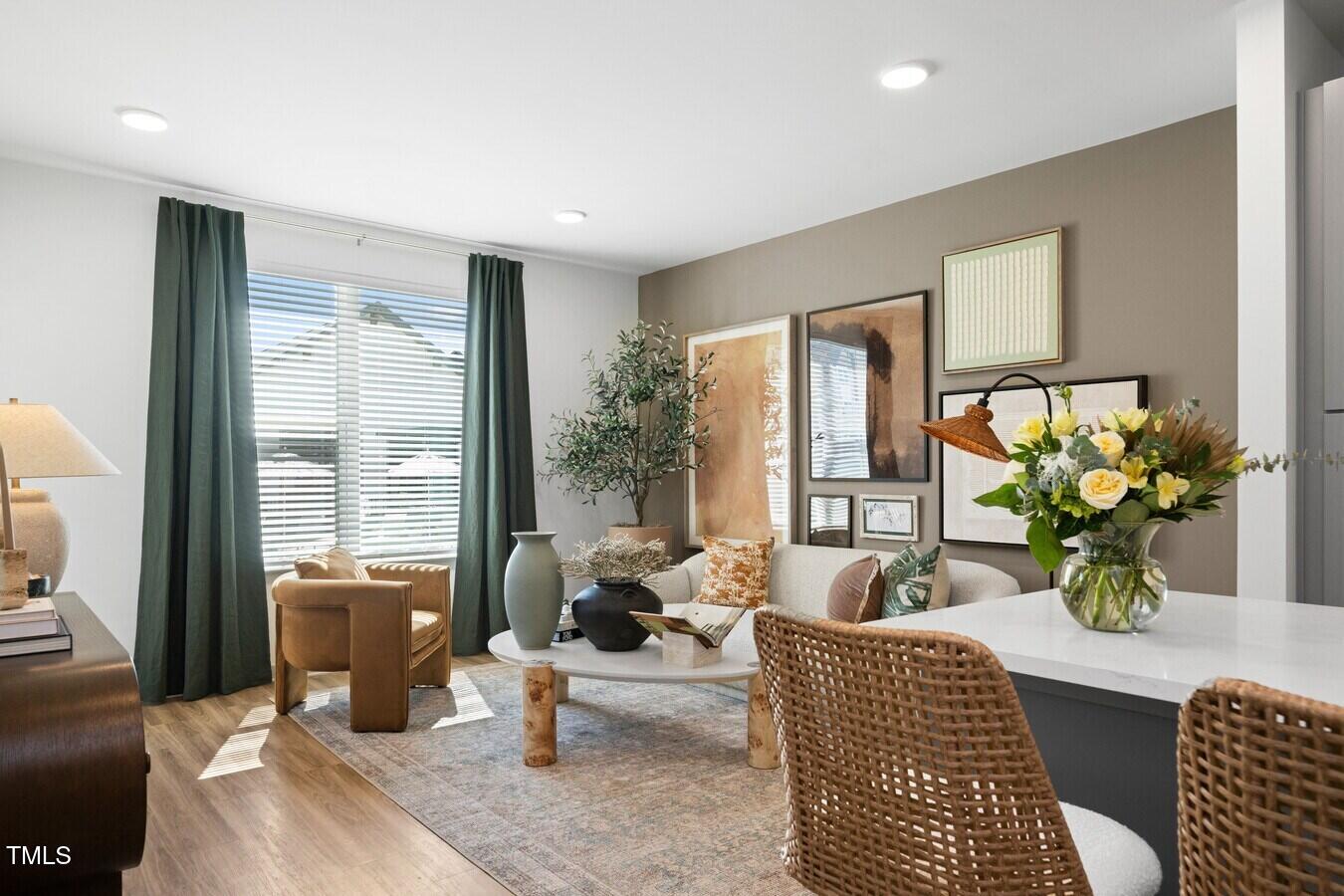 3901 Capital Hills Drive, Unit C1A Raleigh, NC 27616 - Photo 16 of 35 a living room with furniture or couch and a potted plant