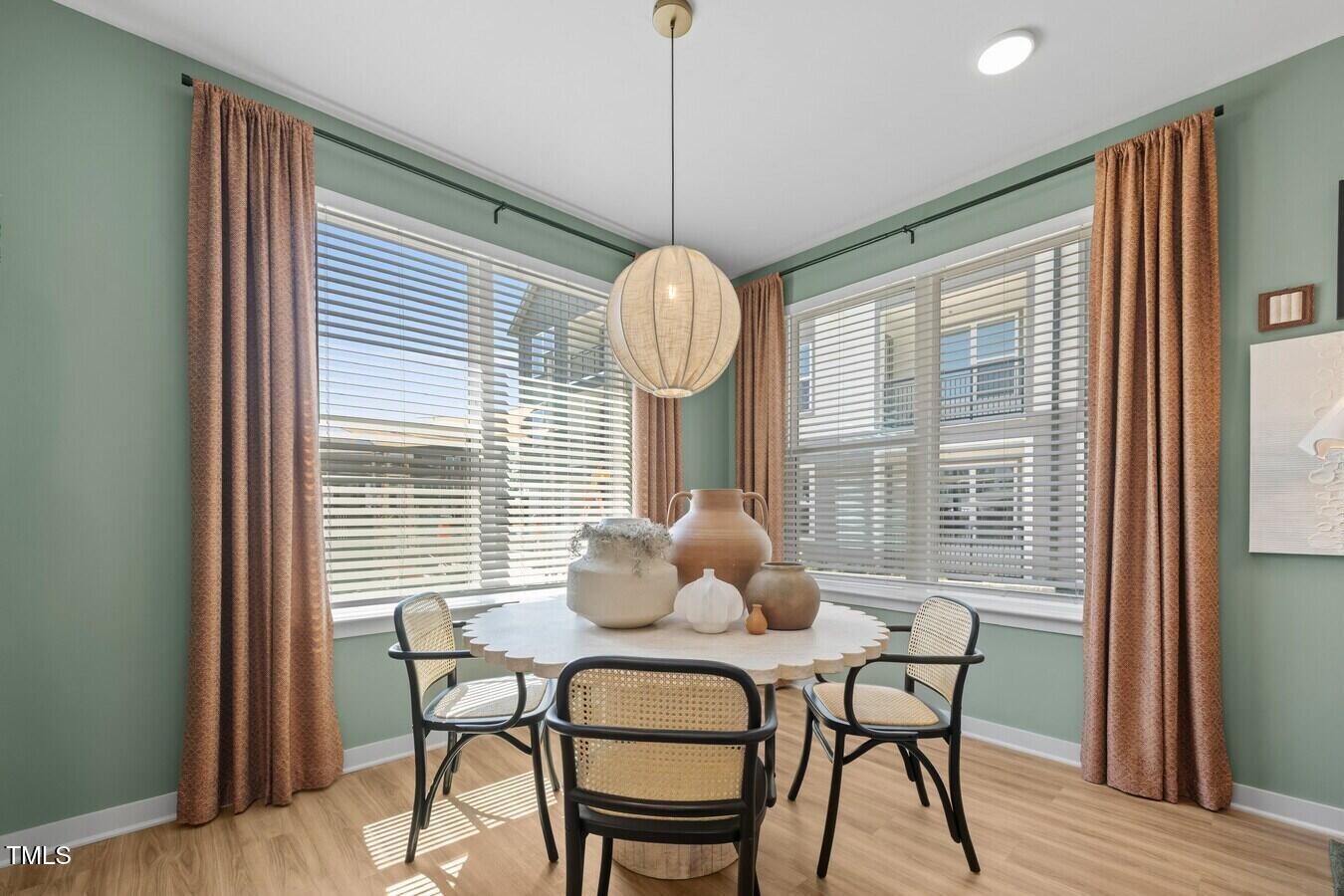 3901 Capital Hills Drive, Unit C1A Raleigh, NC 27616 - Photo 23 of 35 a dining room with furniture and window