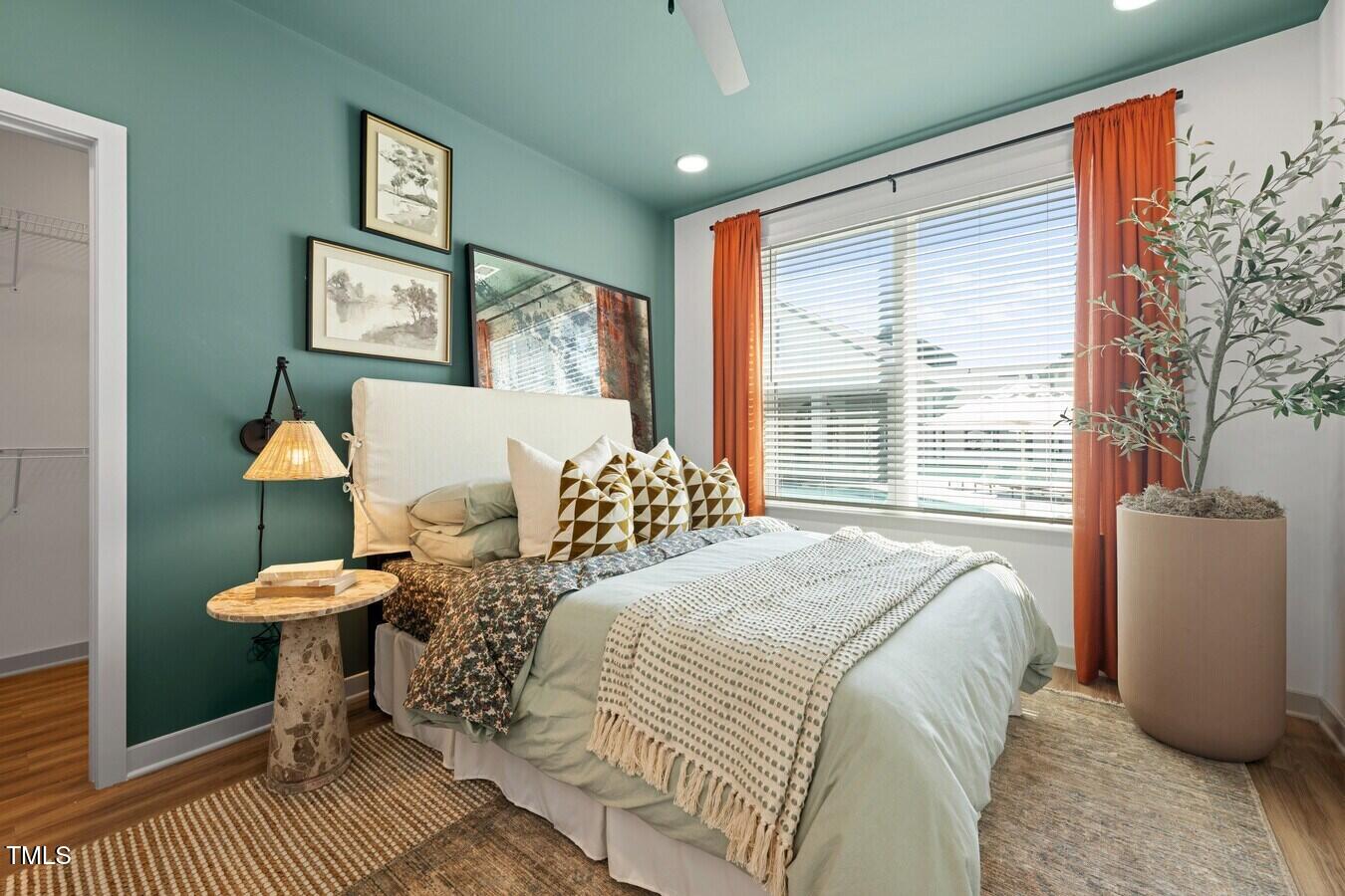 3901 Capital Hills Drive, Unit C1A Raleigh, NC 27616 - Photo 28 of 35 a bedroom with a bed and a window