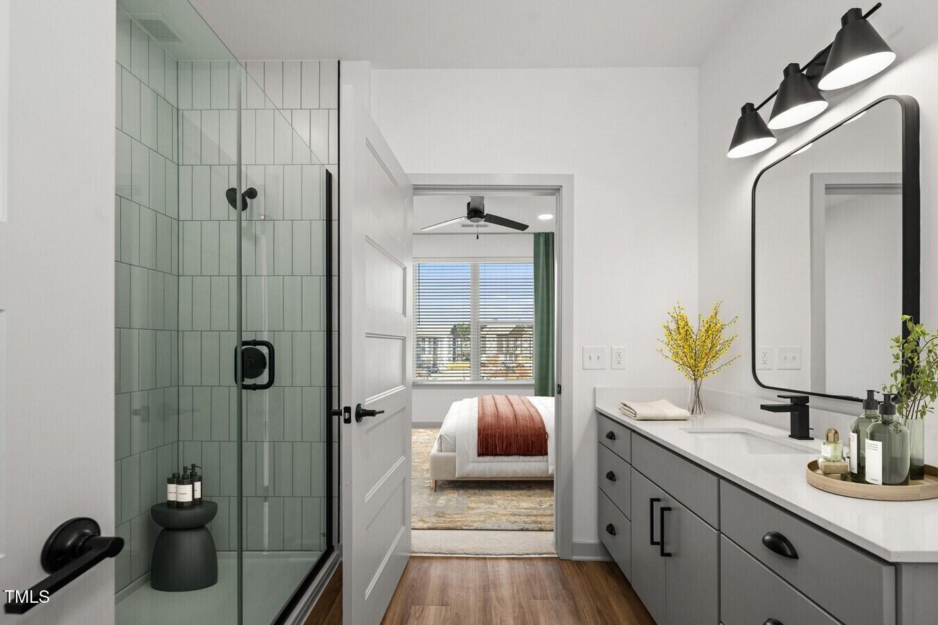 3901 Capital Hills Drive, Unit C1A Raleigh, NC 27616 - Photo 32 of 35 a spacious bathroom with a granite countertop tub sink a mirror a window and vanity