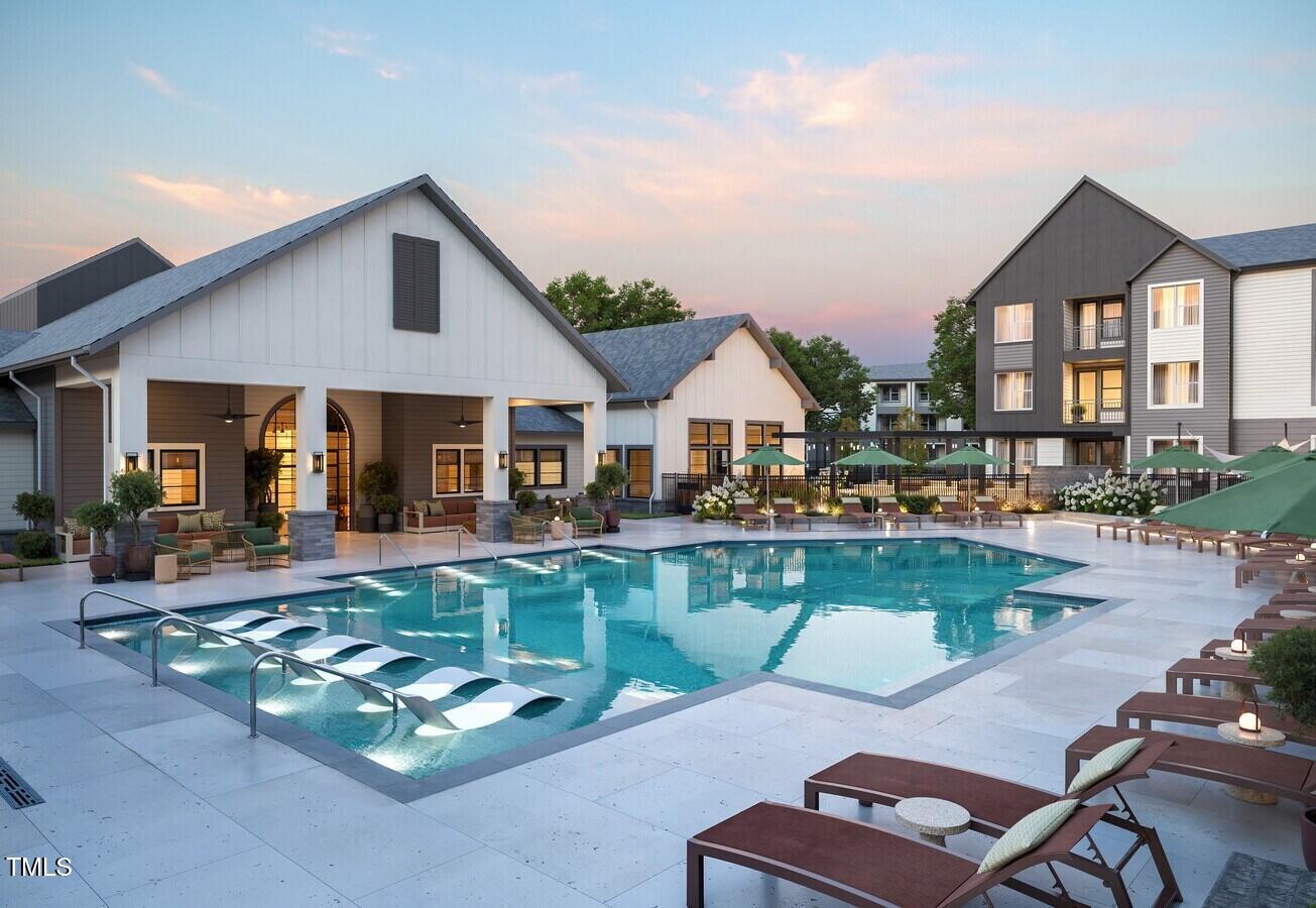 3901 Capital Hills Drive, Unit C1A Raleigh, NC 27616 - Photo 35 of 35 a front view of a house with swimming pool having outdoor seating