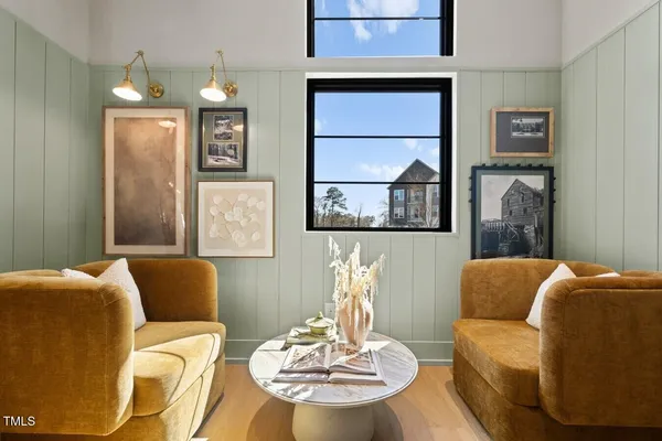 a dining room with furniture a chandelier and window
