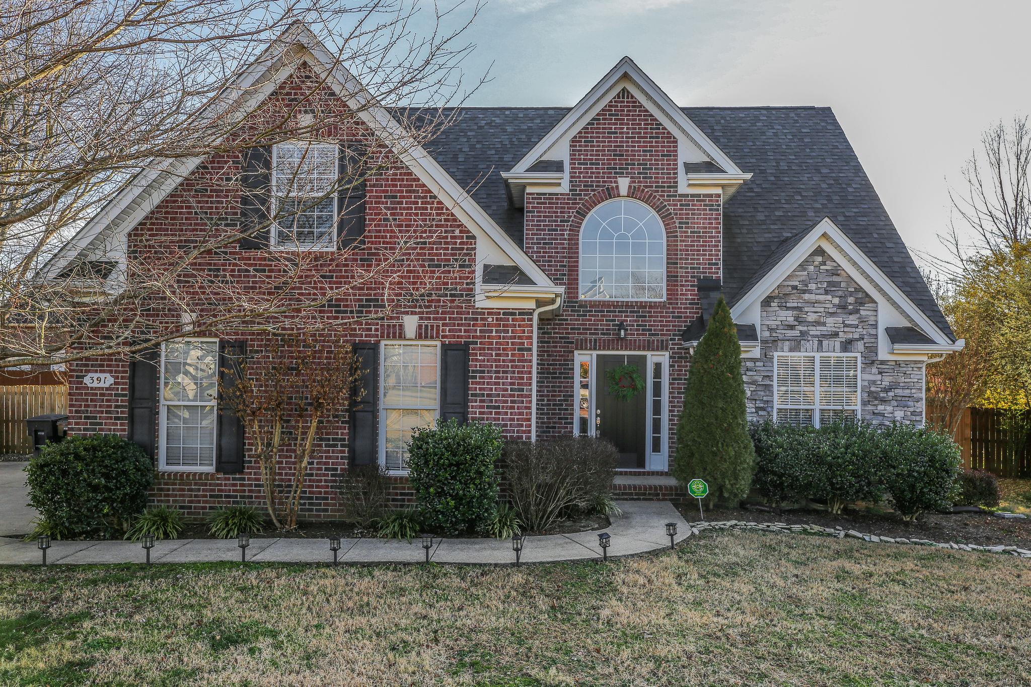 391 Abbie Road Murfreesboro, TN 37128 - Photo 1 of 30 a front view of a house with garden