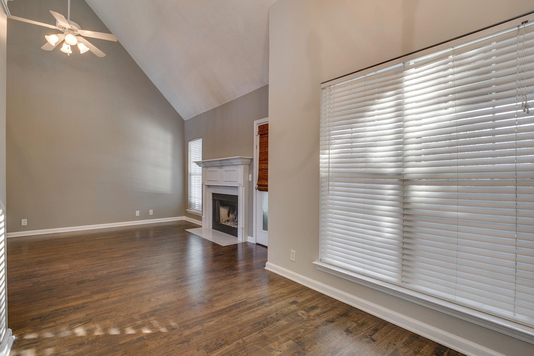 391 Abbie Road Murfreesboro, TN 37128 - Photo 12 of 30 a view of an empty room with wooden floor and a window