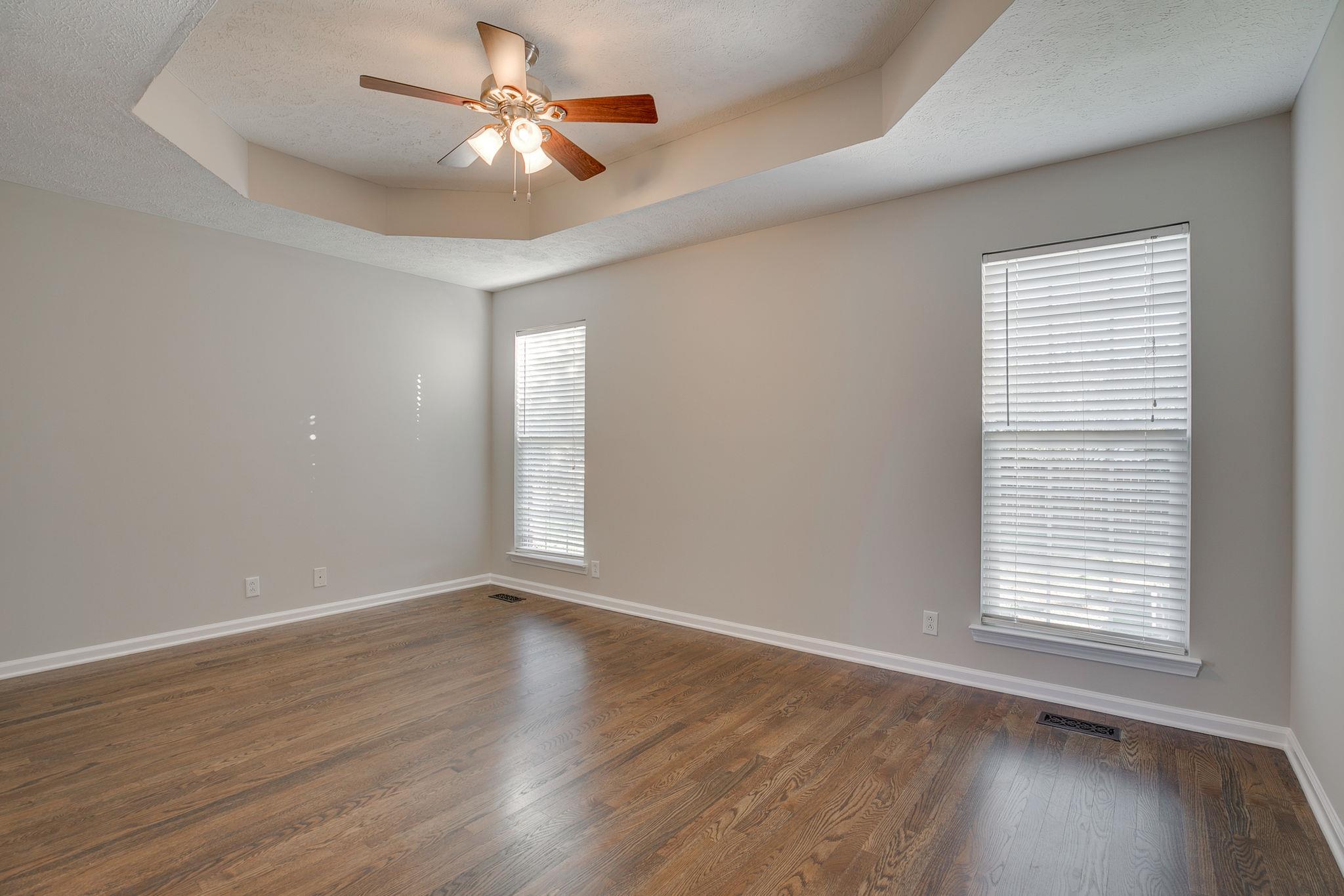 391 Abbie Road Murfreesboro, TN 37128 - Photo 17 of 30 wooden floor in an empty room with a window
