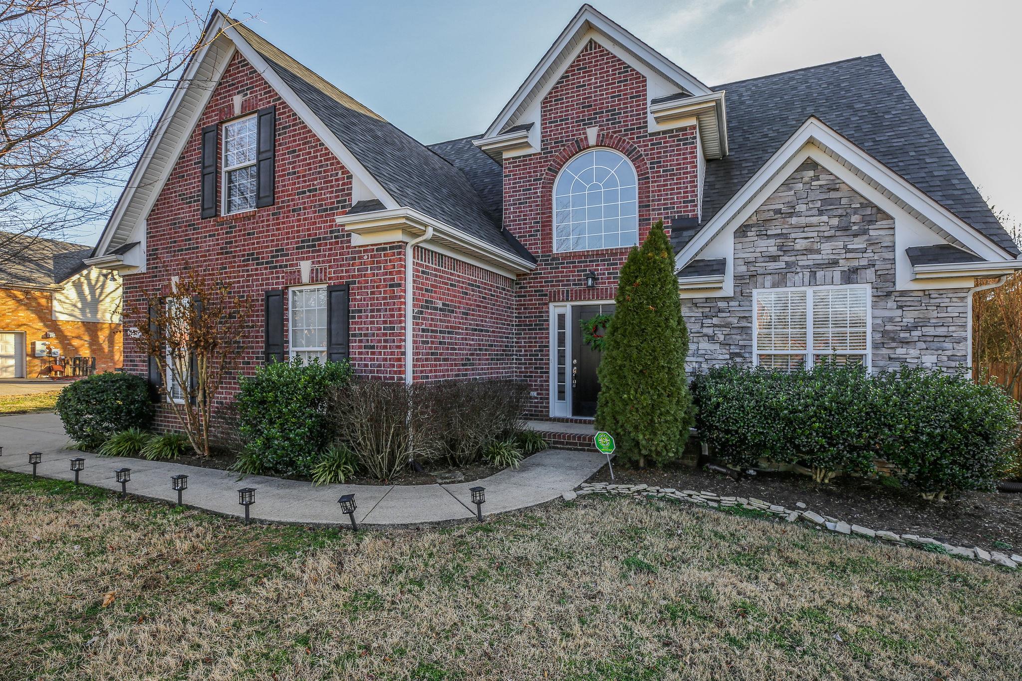 391 Abbie Road Murfreesboro, TN 37128 - Photo 2 of 30 a front view of a house with garden