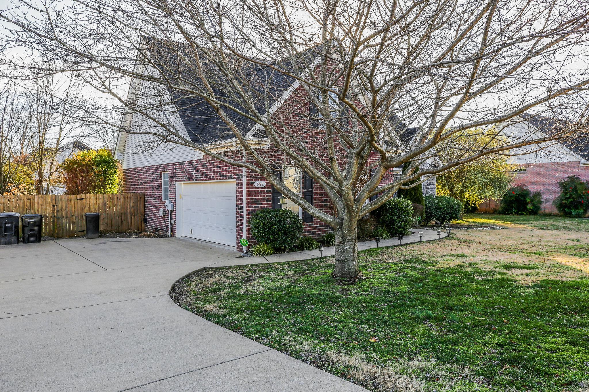 391 Abbie Road Murfreesboro, TN 37128 - Photo 3 of 30 a view of a house with a yard