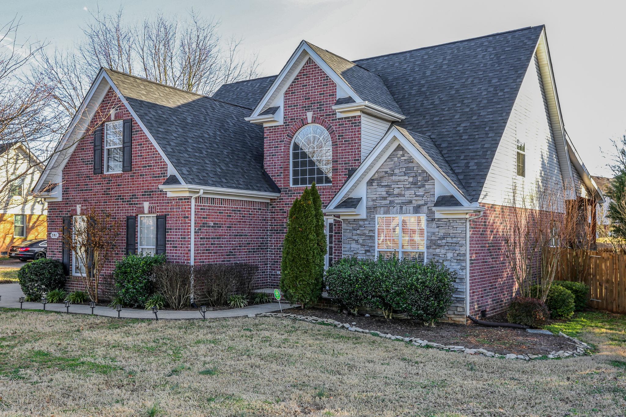 391 Abbie Road Murfreesboro, TN 37128 - Photo 4 of 30 a front view of a house with garden
