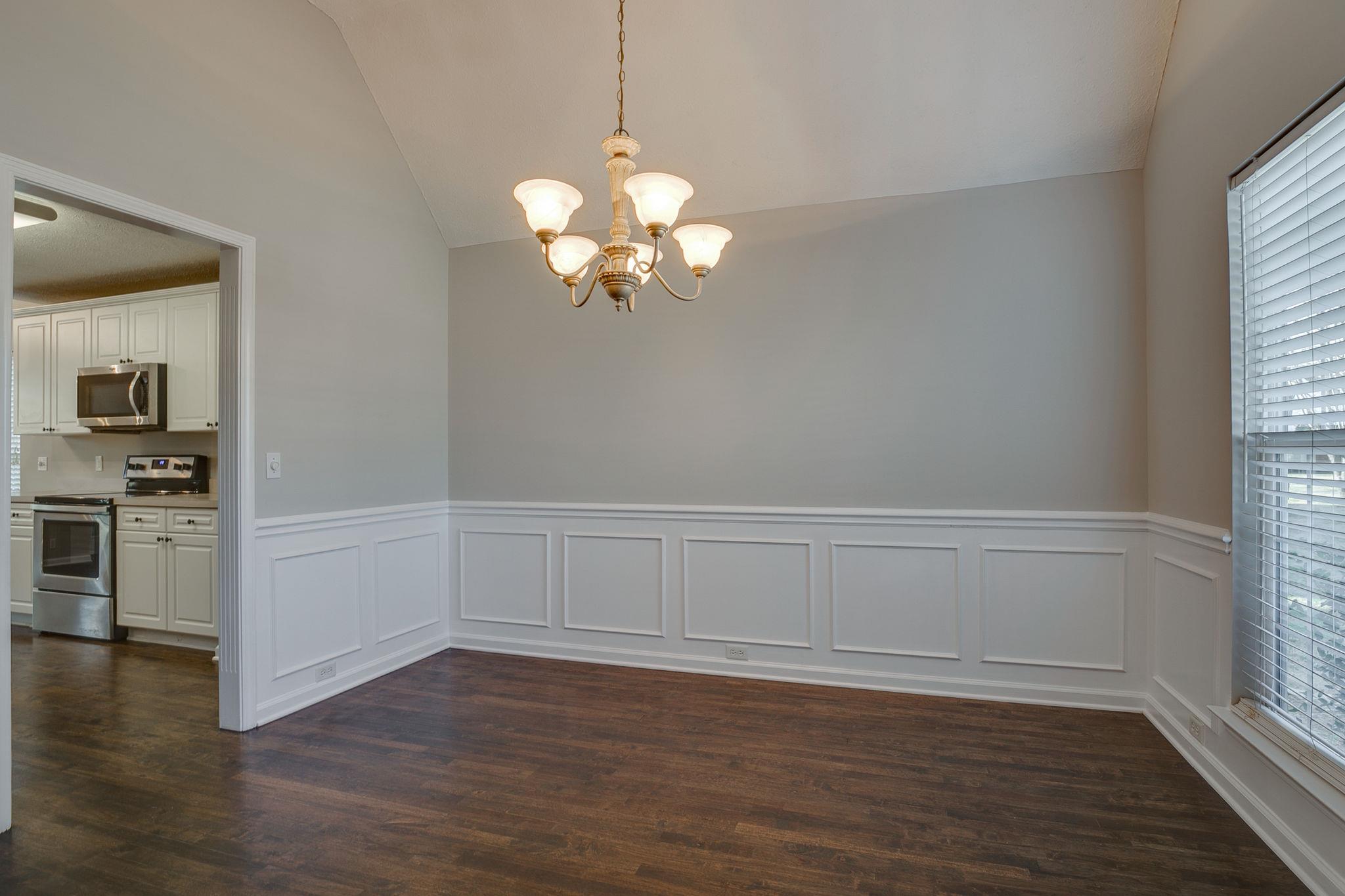 391 Abbie Road Murfreesboro, TN 37128 - Photo 7 of 30 a view of a kitchen with wooden floor and a window