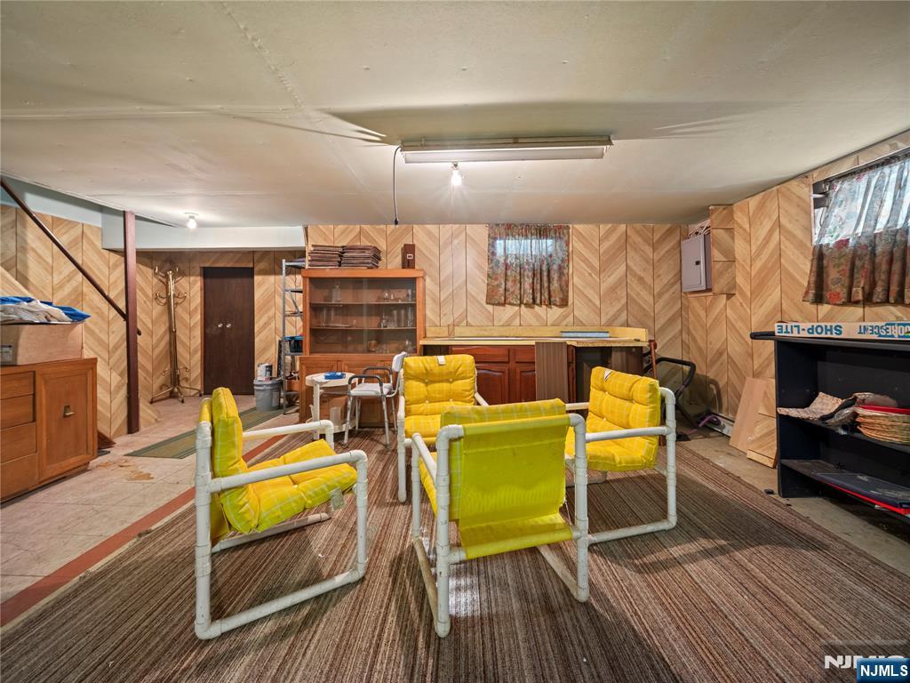 5 Woodland Road Bloomfield, NJ 07003 - Photo 25 of 30 a living room with furniture and a wooden floor