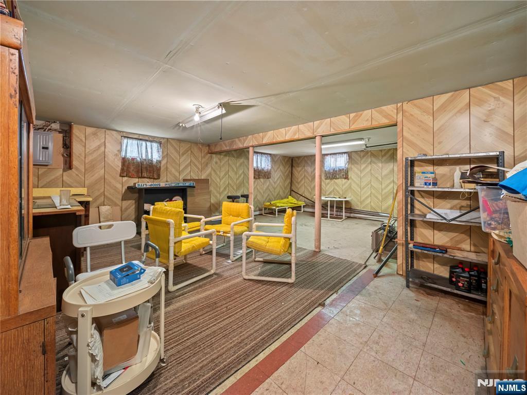 5 Woodland Road Bloomfield, NJ 07003 - Photo 26 of 30 a living room filled with furniture and a table