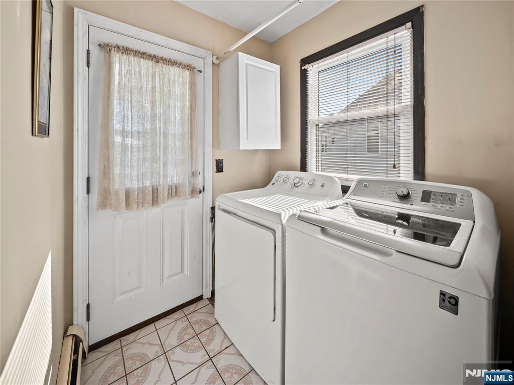 5 Woodland Road Bloomfield, NJ 07003 - Photo 27 of 30 a utility room with dryer and washer