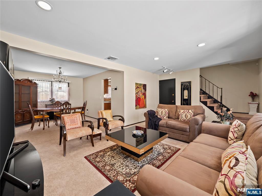 5 Woodland Road Bloomfield, NJ 07003 - Photo 5 of 30 a living room with furniture and a rug