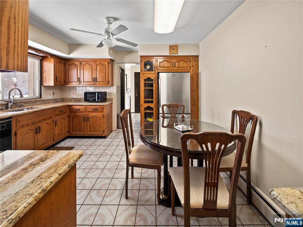 5 Woodland Road Bloomfield, NJ 07003 - Photo 8 of 30 a view of a dining room with furniture and a chandelier