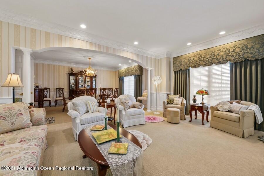 179 Stone Hill Road Colts Neck, NJ 07722 - Photo 15 of 57 a living room with furniture and a large window