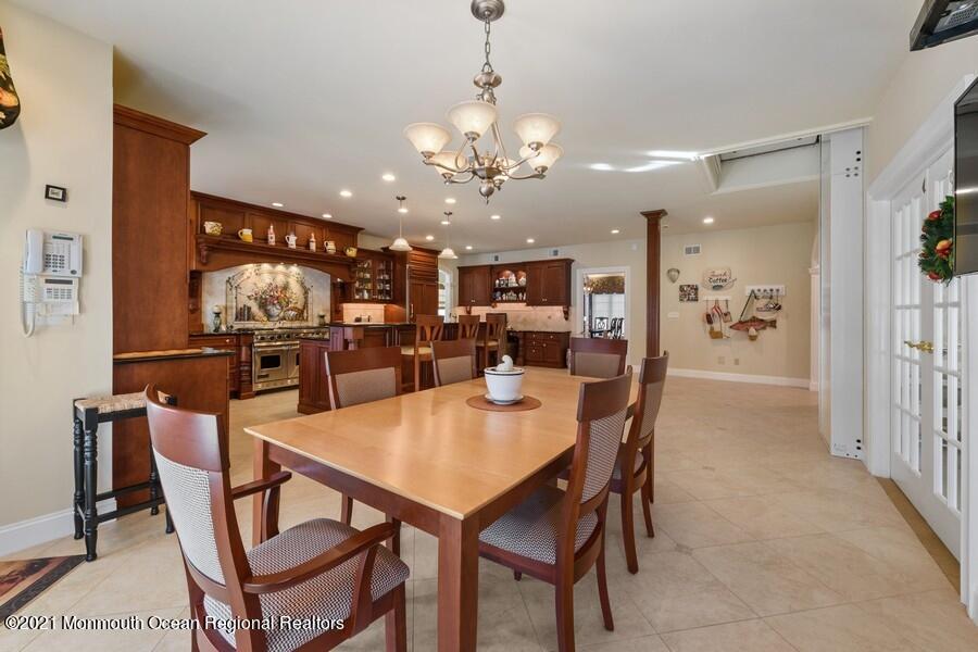 179 Stone Hill Road Colts Neck, NJ 07722 - Photo 20 of 57 a dining room with furniture and chandelier