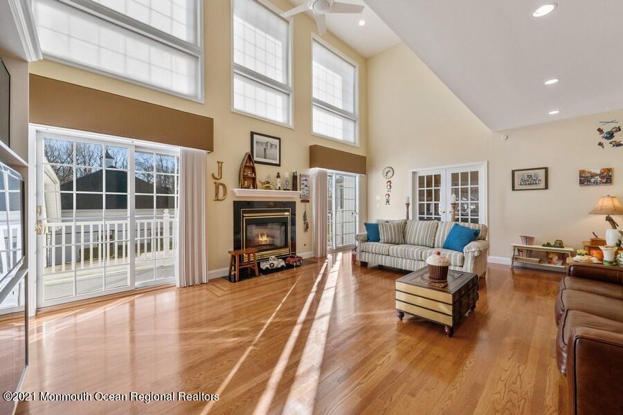 179 Stone Hill Road Colts Neck, NJ 07722 - Photo 24 of 57 a living room with furniture and a fireplace