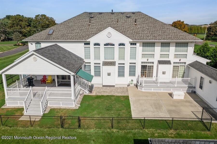 179 Stone Hill Road Colts Neck, NJ 07722 - Photo 3 of 57 front view of a house with a yard