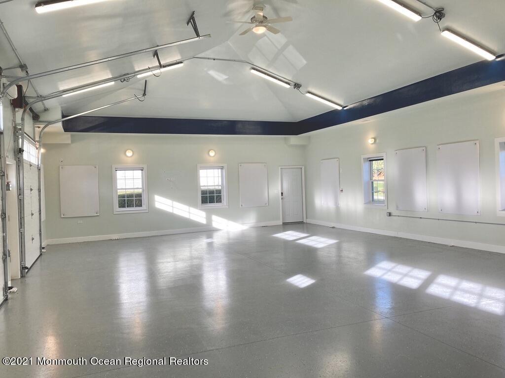 179 Stone Hill Road Colts Neck, NJ 07722 - Photo 42 of 57 a view of a hallway with chandelier