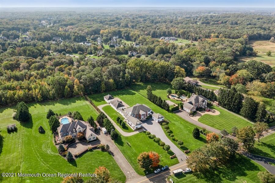 179 Stone Hill Road Colts Neck, NJ 07722 - Photo 43 of 57 an aerial view of a golf course with parking space