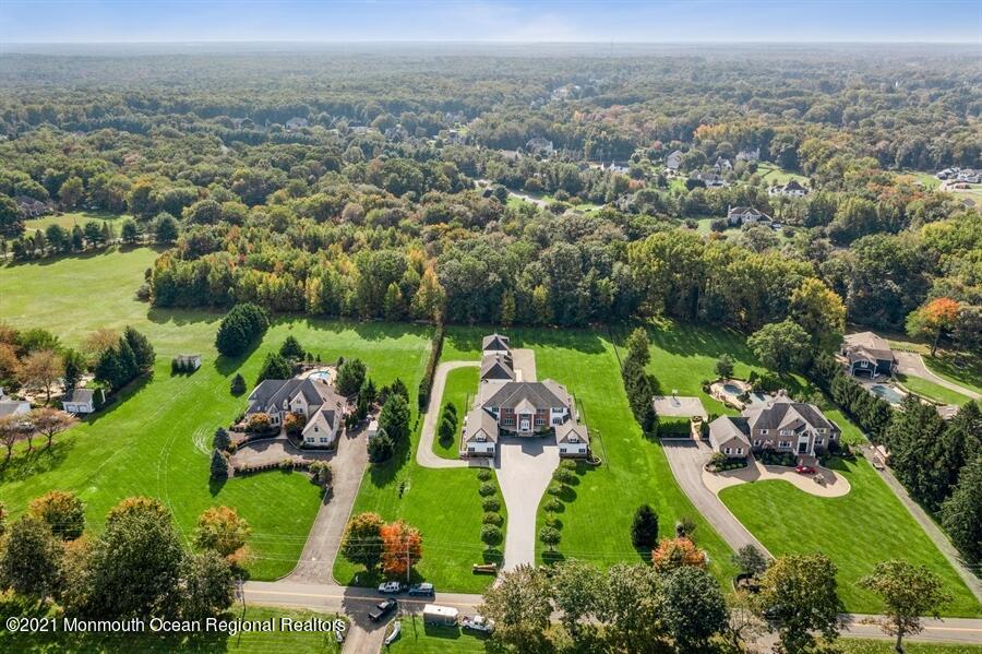 179 Stone Hill Road Colts Neck, NJ 07722 - Photo 48 of 57 an aerial view of a golf course with chairs