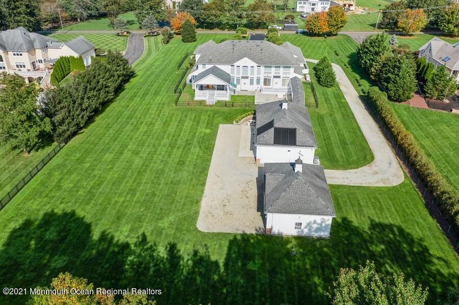 179 Stone Hill Road Colts Neck, NJ 07722 - Photo 49 of 57 an aerial view of a house