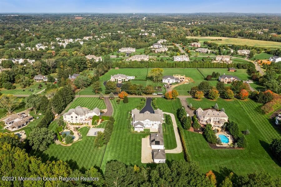 179 Stone Hill Road Colts Neck, NJ 07722 - Photo 50 of 57 an aerial view of residential houses with outdoor space