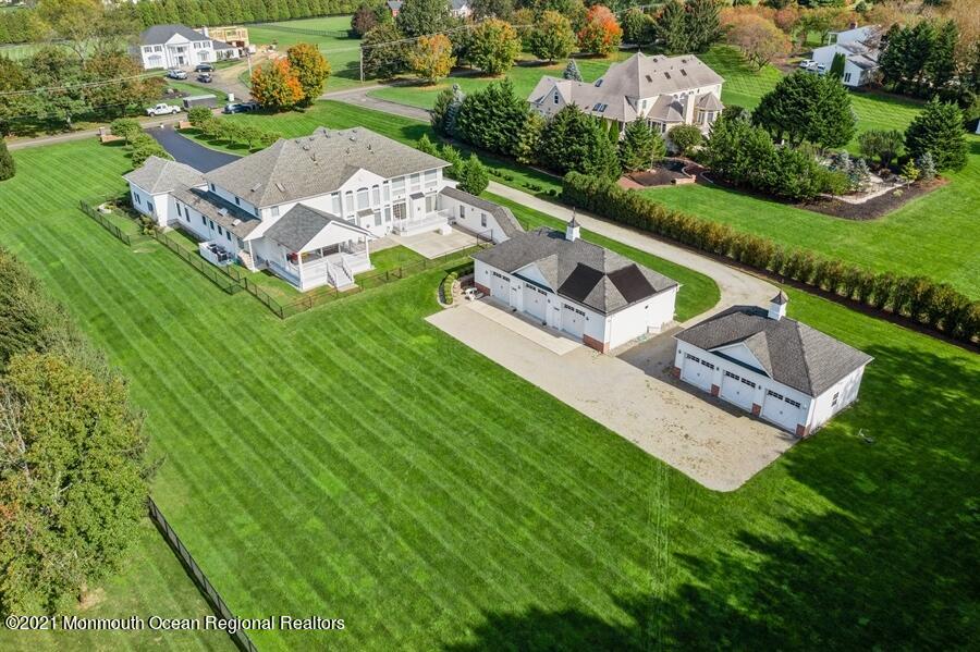 179 Stone Hill Road Colts Neck, NJ 07722 - Photo 57 of 57 an aerial view of a house with garden