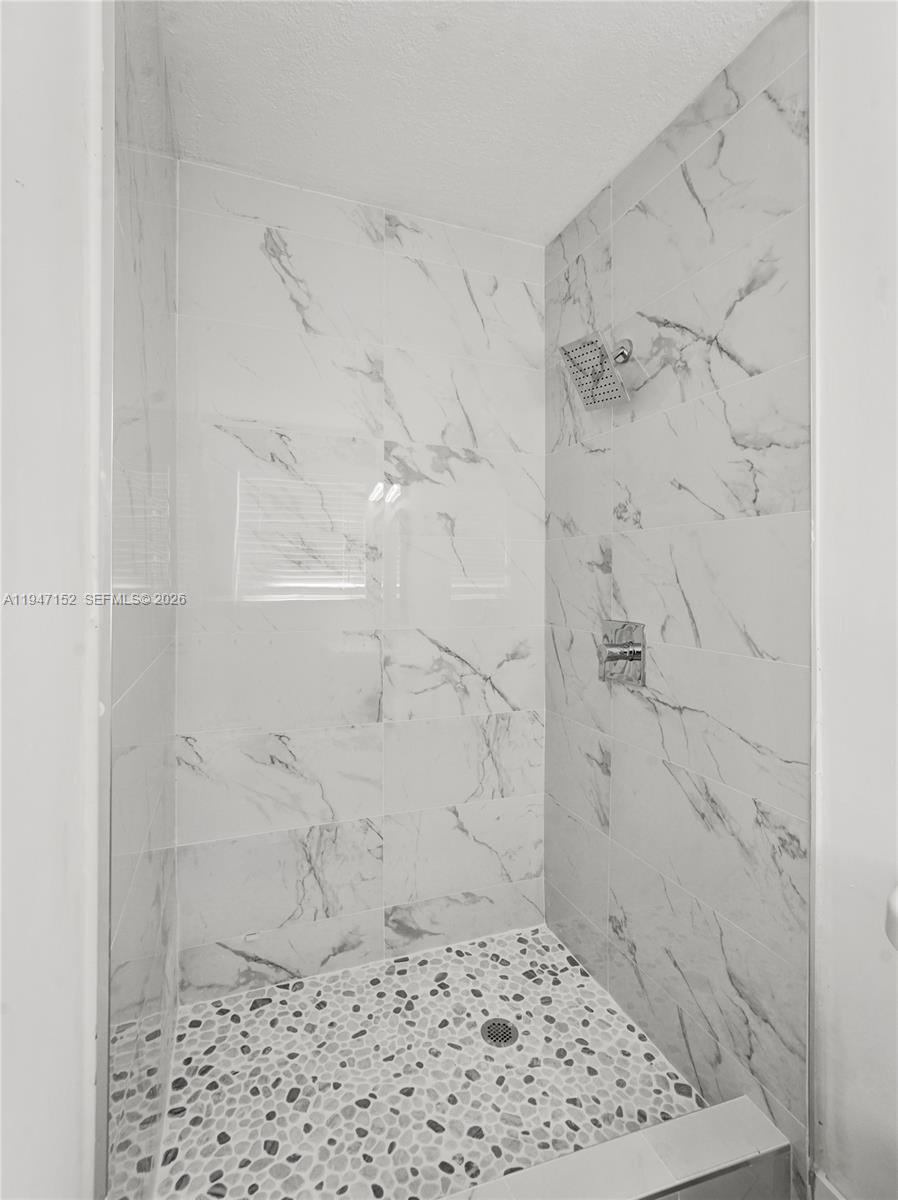 5657 Grant Street, Unit 2 Hollywood, FL 33021 - Photo 9 of 13 a bathroom with a shower