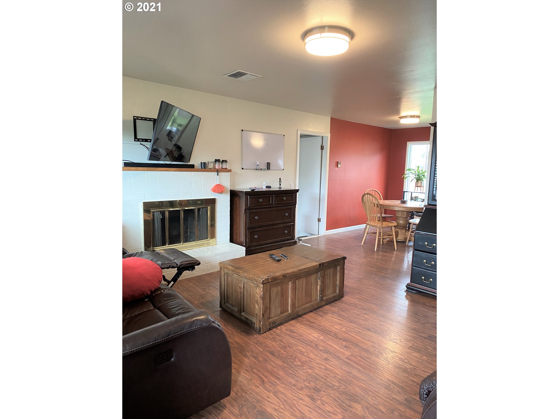 1070 N Street Springfield, OR 97477 - Photo 2 of 14 a living room with furniture and a fireplace