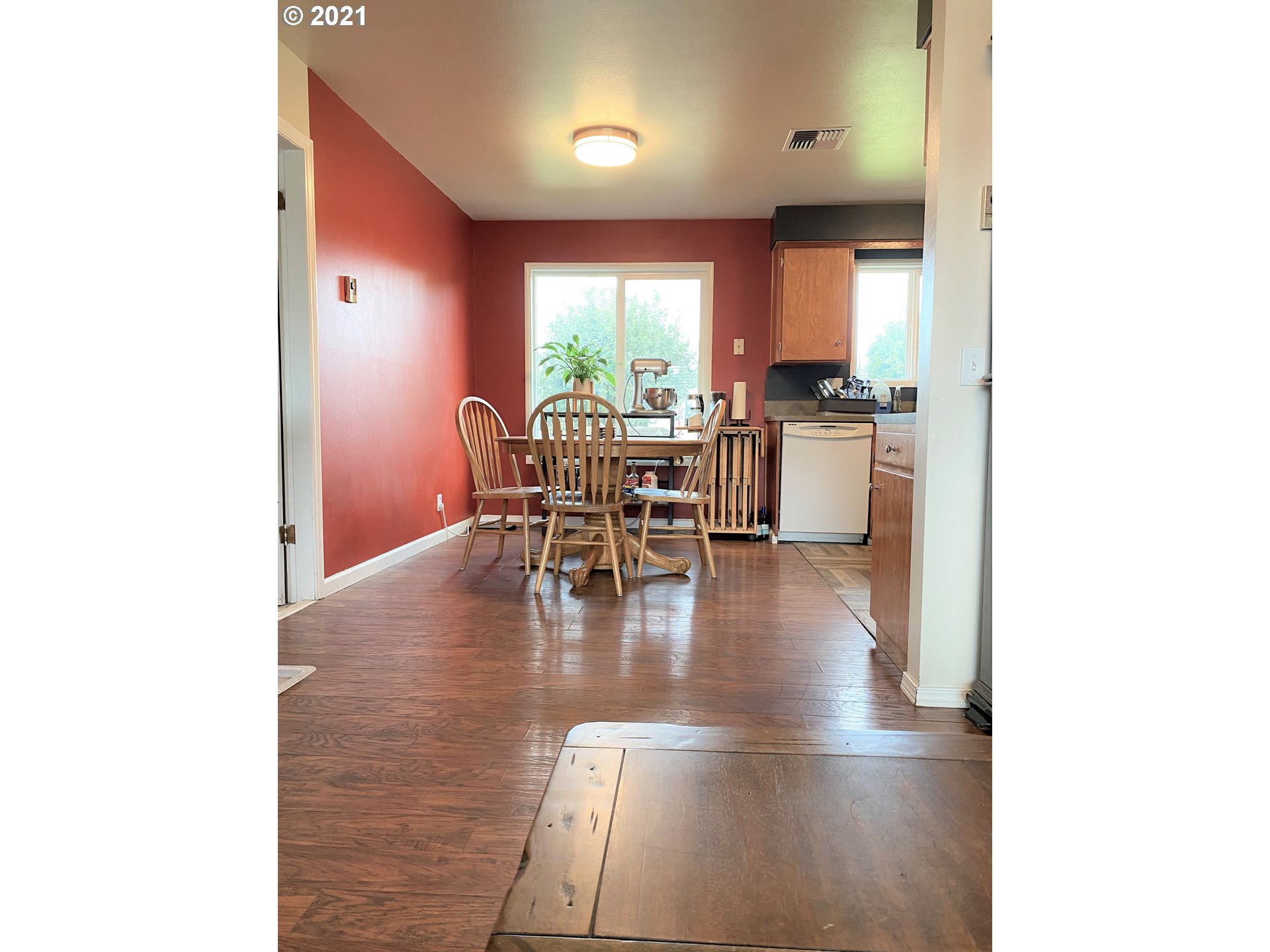1070 N Street Springfield, OR 97477 - Photo 7 of 14 a dining room with furniture and wooden floor
