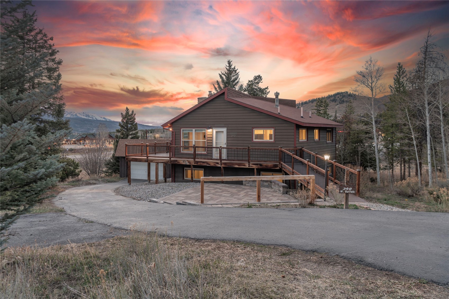 340 Buffalo Street Dillon, CO 80435 - Photo 6 of 40 a front view of a house with a yard and wooden fence