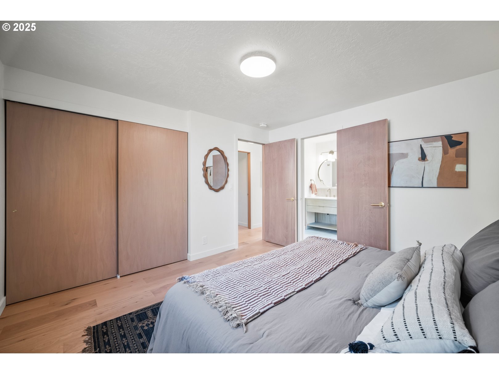7235 Northeast 9th Avenue Portland, OR 97211 - Photo 17 of 22 a bedroom with a bed and a dresser