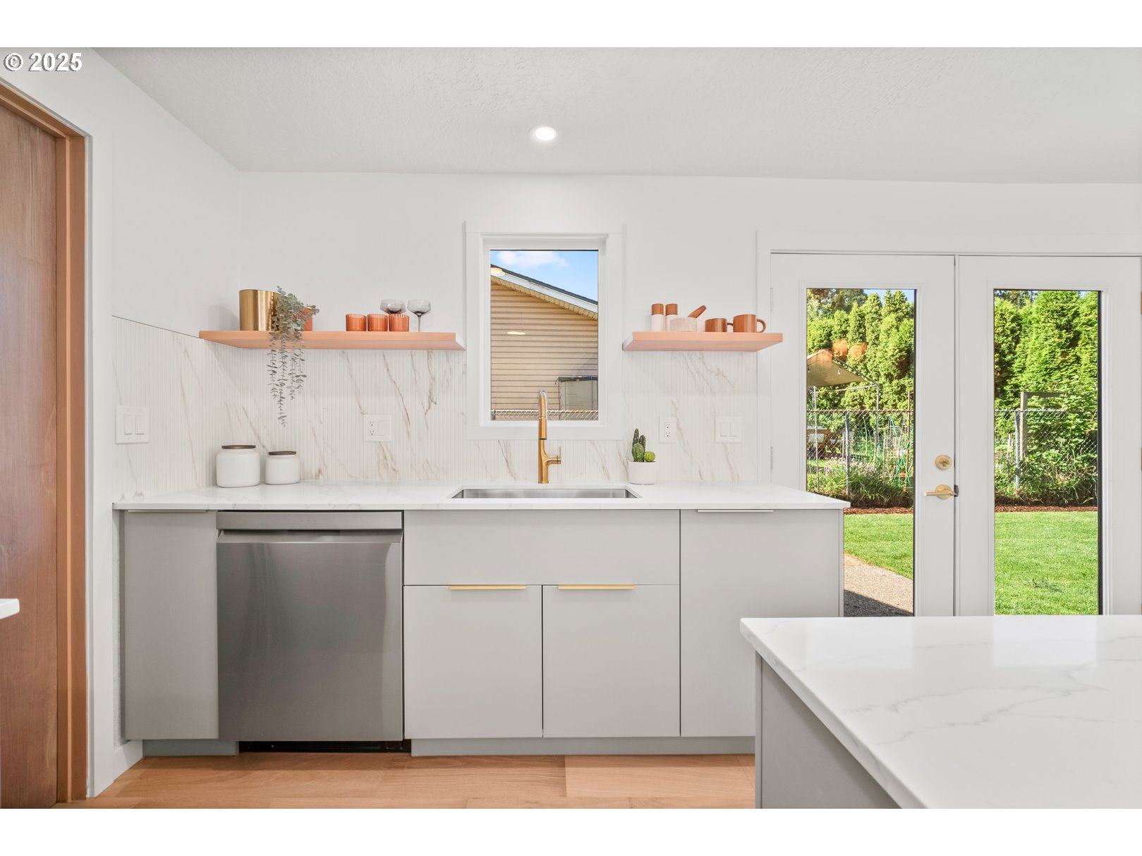 7235 Northeast 9th Avenue Portland, OR 97211 - Photo 6 of 22 a utility room with cabinets a window and a sink