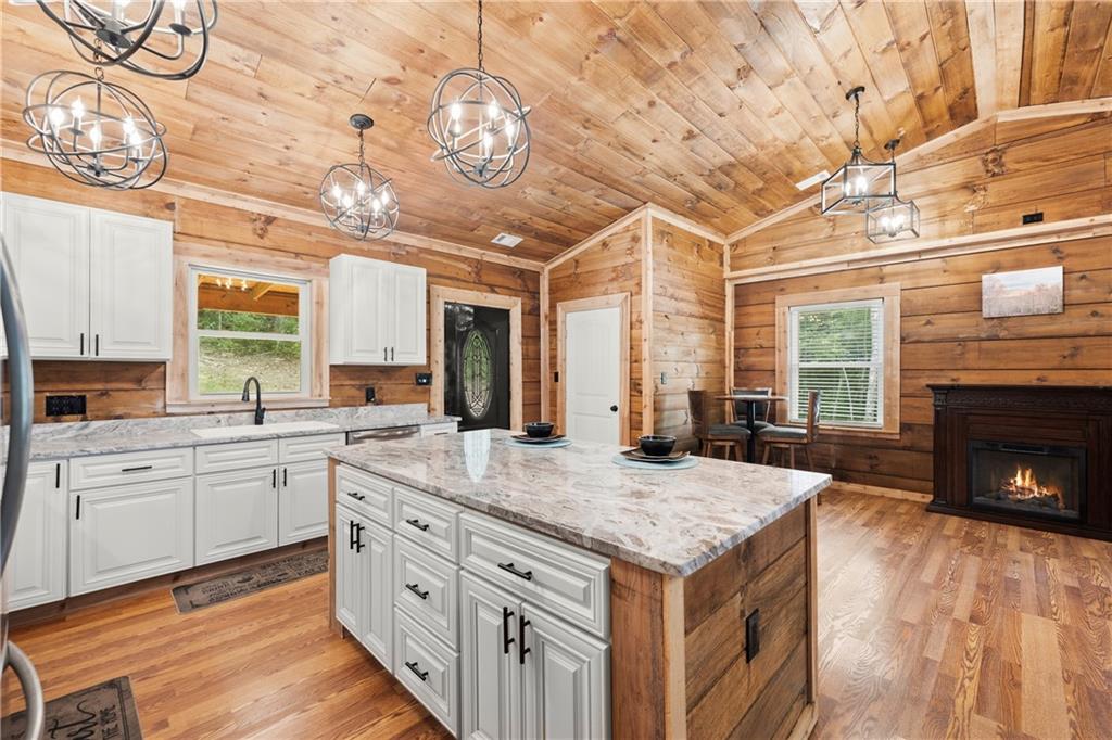 587 Cold Stream Trail Jasper, GA 30143 - Photo 13 of 41 a kitchen with stainless steel appliances granite countertop a stove and cabinets