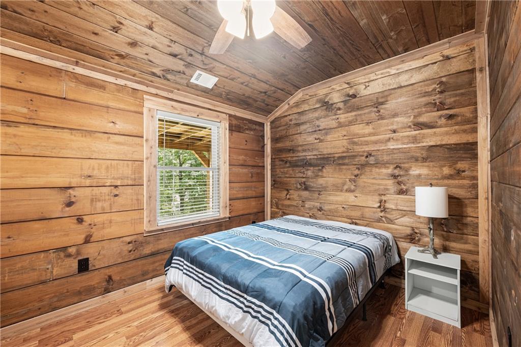 587 Cold Stream Trail Jasper, GA 30143 - Photo 15 of 41 a bedroom with a bed and a window