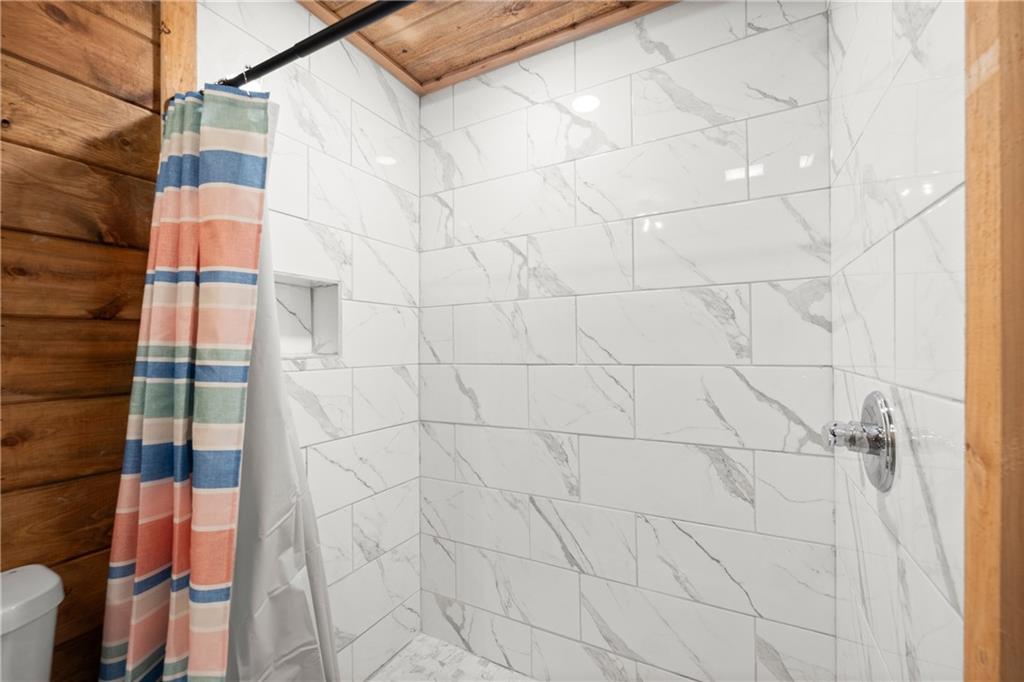 587 Cold Stream Trail Jasper, GA 30143 - Photo 18 of 41 a bathroom with a shower