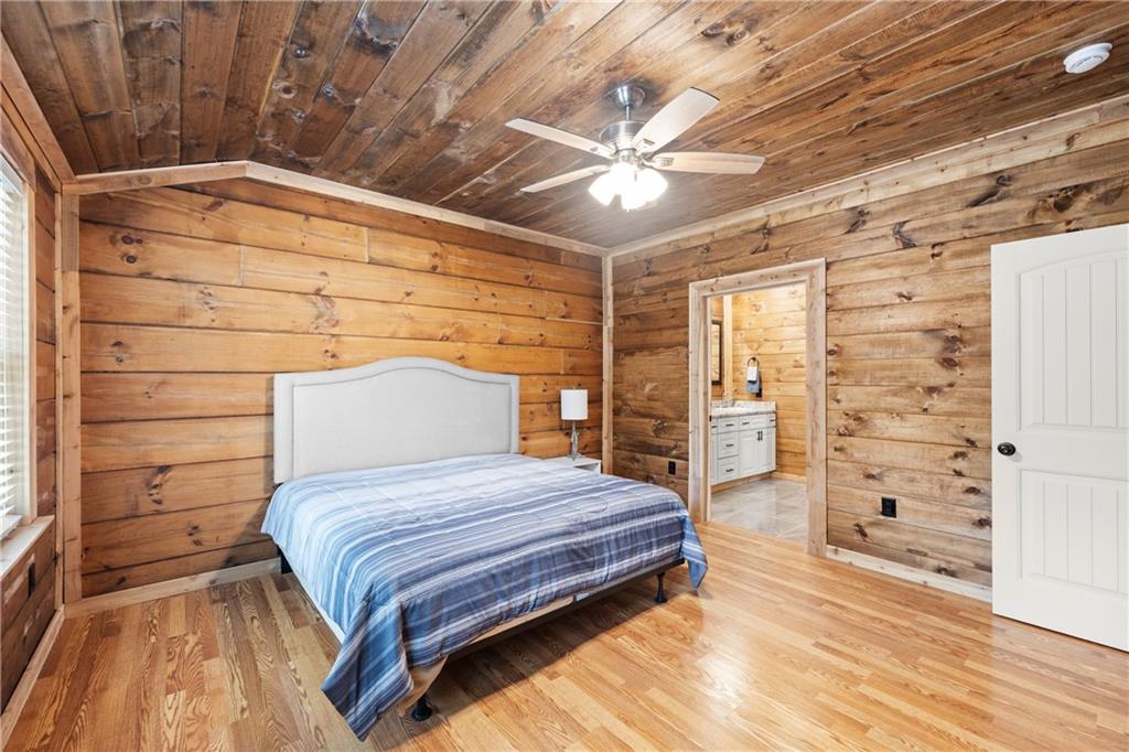 587 Cold Stream Trail Jasper, GA 30143 - Photo 21 of 41 a bedroom with a bed and a walk in closet