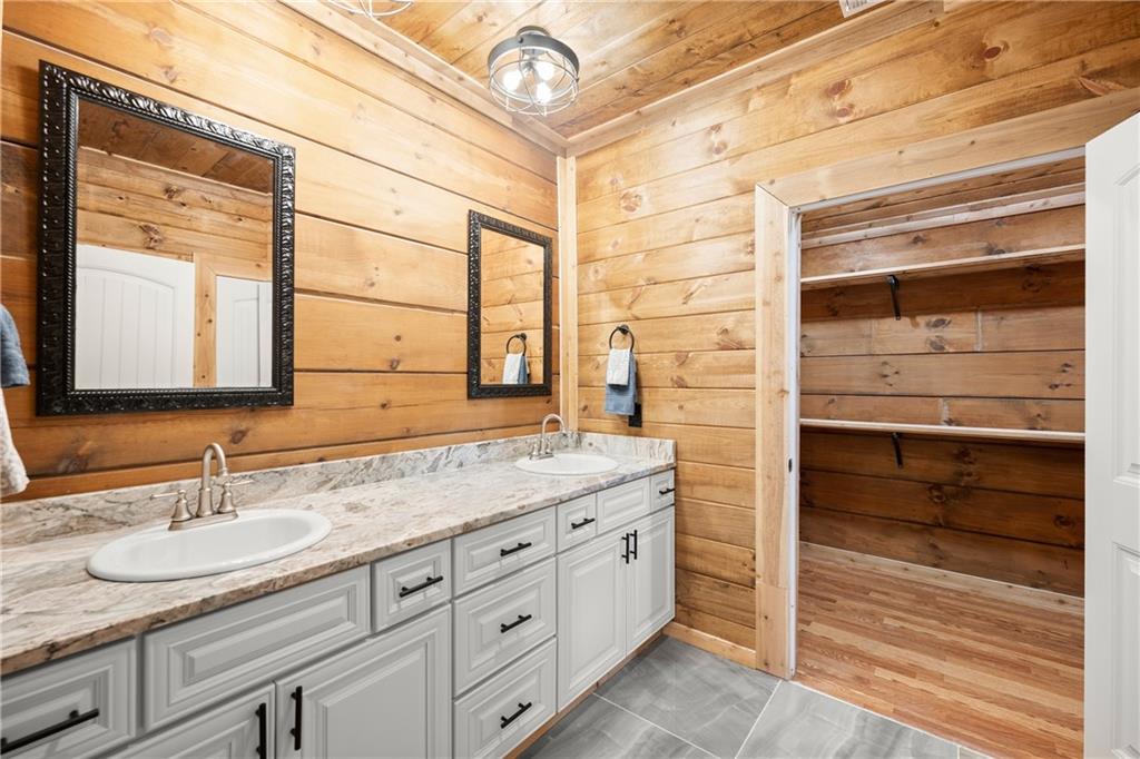 587 Cold Stream Trail Jasper, GA 30143 - Photo 22 of 41 a bathroom with a granite countertop sink and a mirror