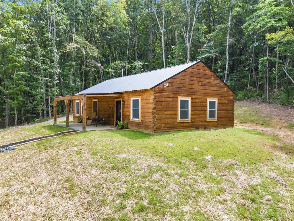 587 Cold Stream Trail Jasper, GA 30143 - Photo 26 of 41 a view of a yard in front of a house with large tree
