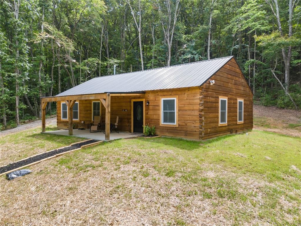 587 Cold Stream Trail Jasper, GA 30143 - Photo 27 of 41 a house with trees in the background