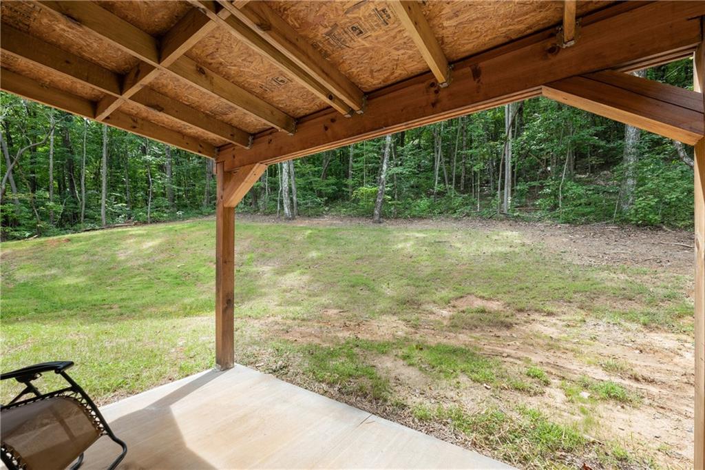 587 Cold Stream Trail Jasper, GA 30143 - Photo 31 of 41 a view of a backyard with plants and a backyard