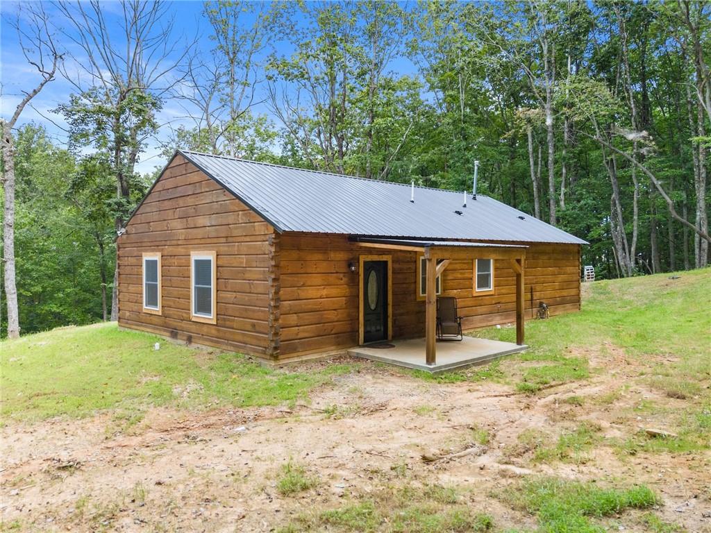 587 Cold Stream Trail Jasper, GA 30143 - Photo 32 of 41 a front view of a house with garden