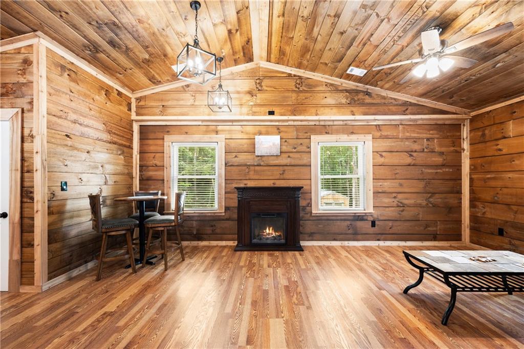 587 Cold Stream Trail Jasper, GA 30143 - Photo 5 of 41 a living room with a table chairs and a fireplace