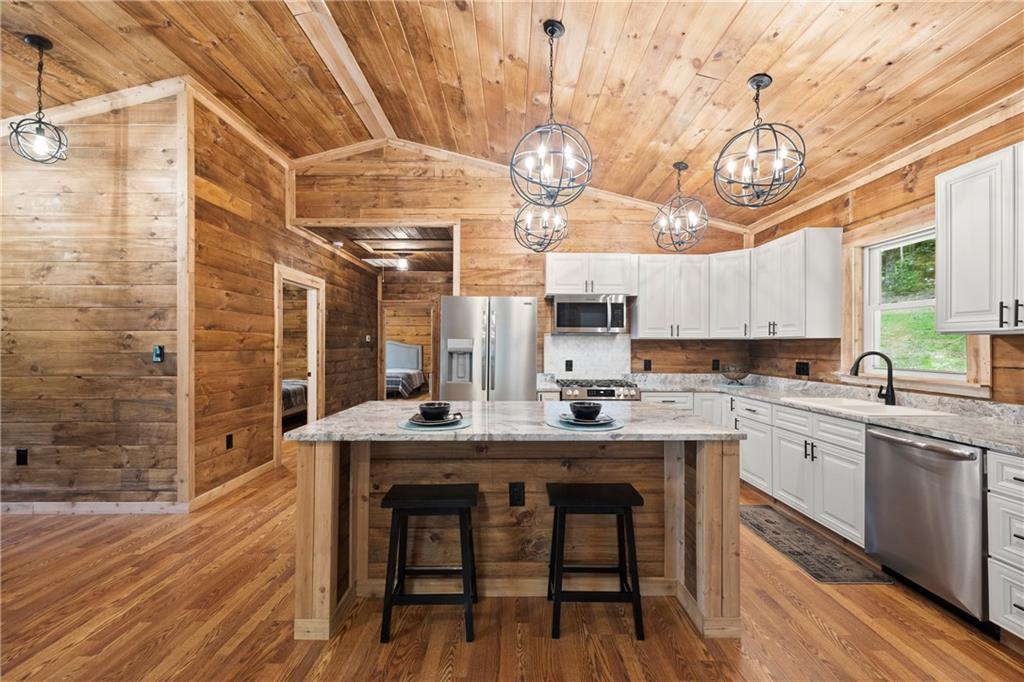 587 Cold Stream Trail Jasper, GA 30143 - Photo 10 of 41 a kitchen with a sink cabinets and wooden floor